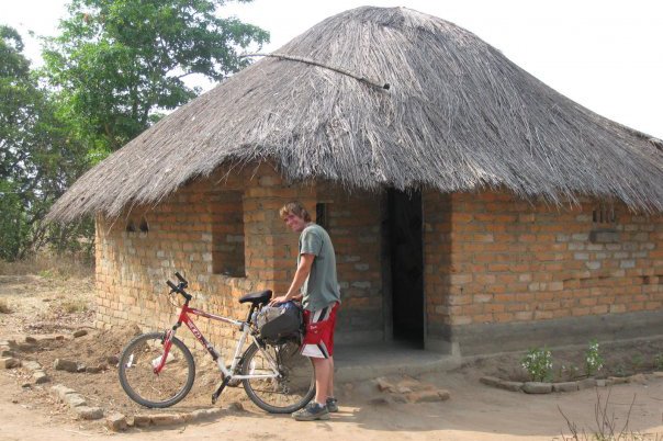 Casey arriving back to his house in Peace Corps after a long bike ride
