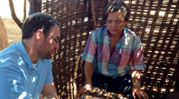 immy (Nuru Education PSA) and Becca in a serious game of checkers (dama) at the local bunna bet (coffee place).