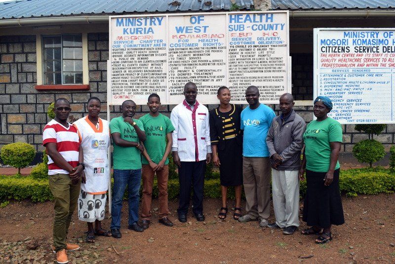 Nuru Kenya Healthcare team and Mogori Komasimo healthcare workers posing for a photo after the successful campaign