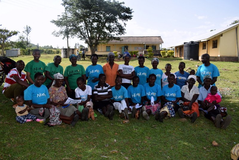 Nuru Kenya Healthcare team and Nyatira women group posing for a group photo after a successful group meeting and Exclusive breastfeeding training at Kombe Dispensary, Migori County