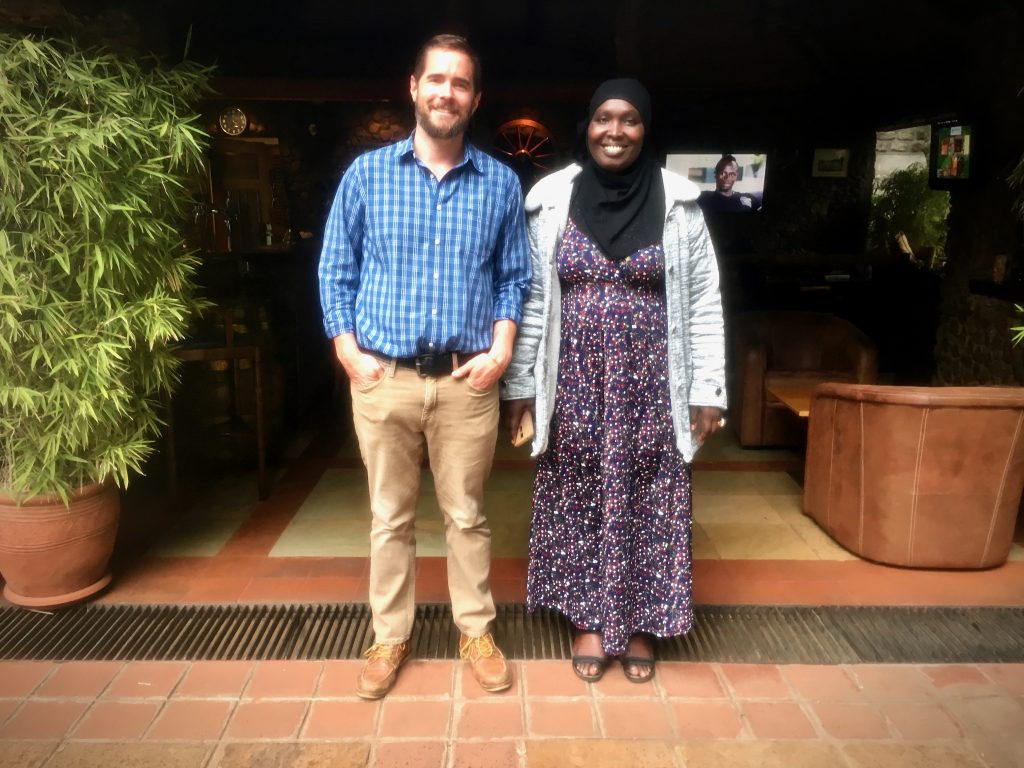 two people standing together outside and smiling at AMEA Global Convening