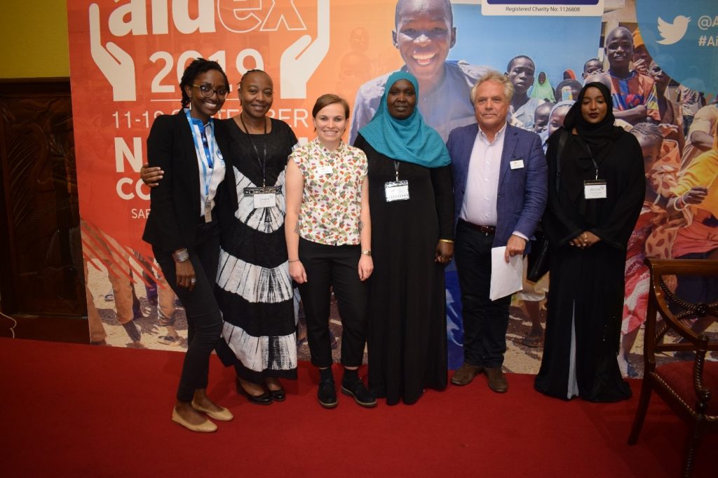 group of people smiling at conference in Kenya