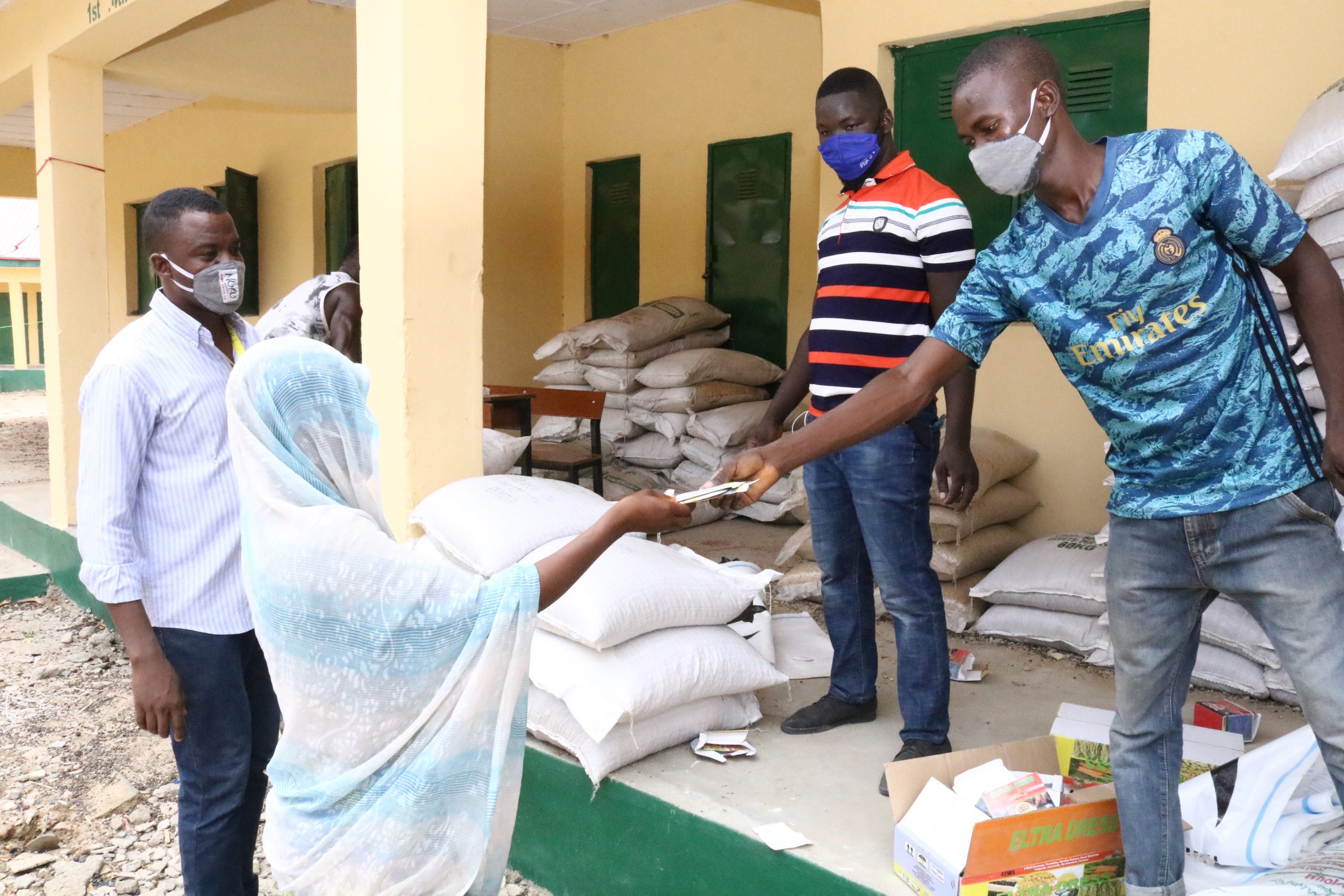 crop packages being distributed to woman