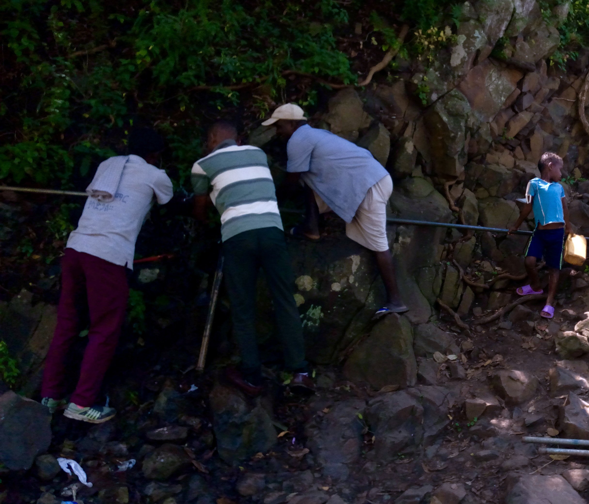 people repairing water source in Ethiopia