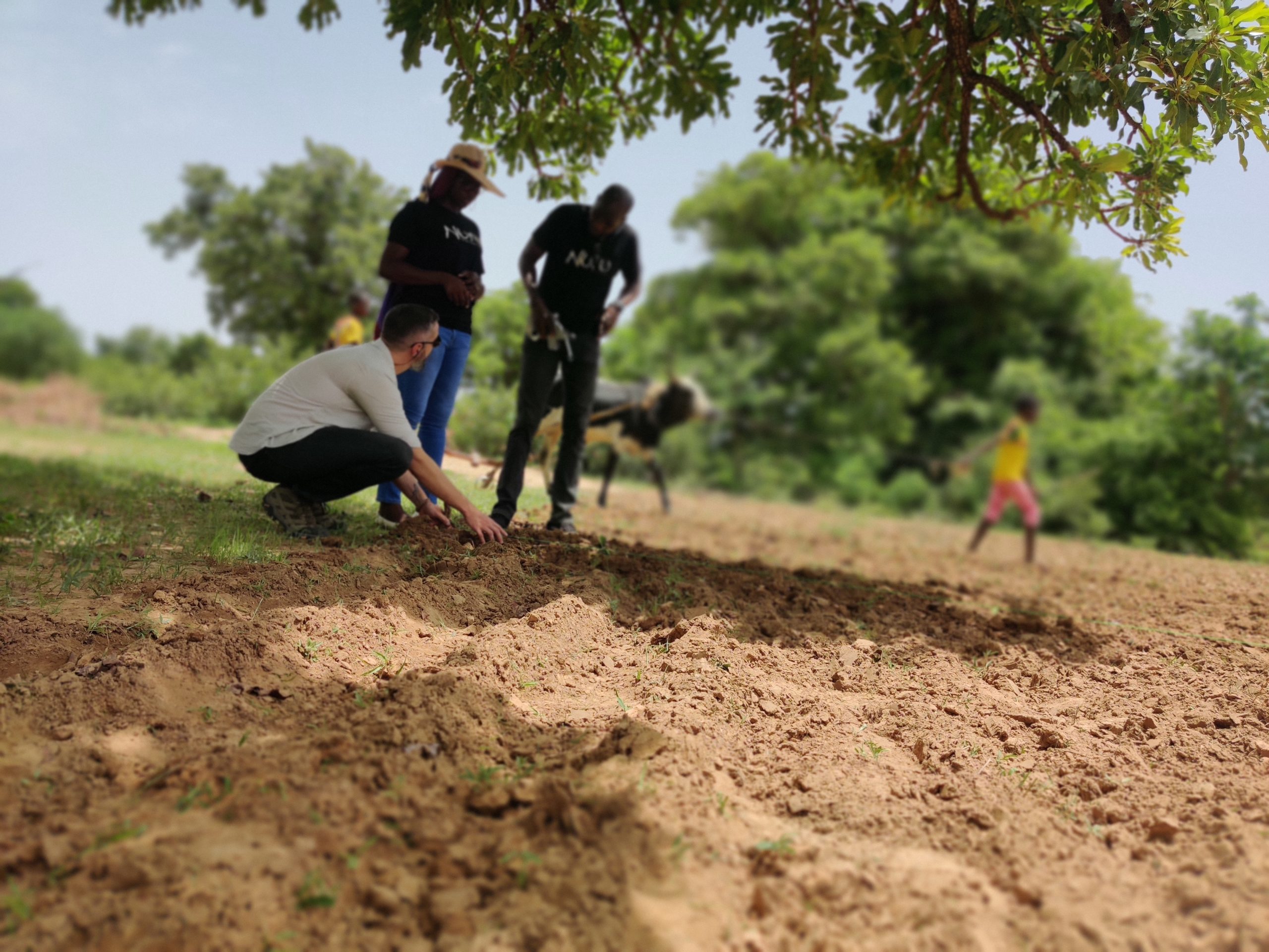 man in field in Burkina Faso facilitating training