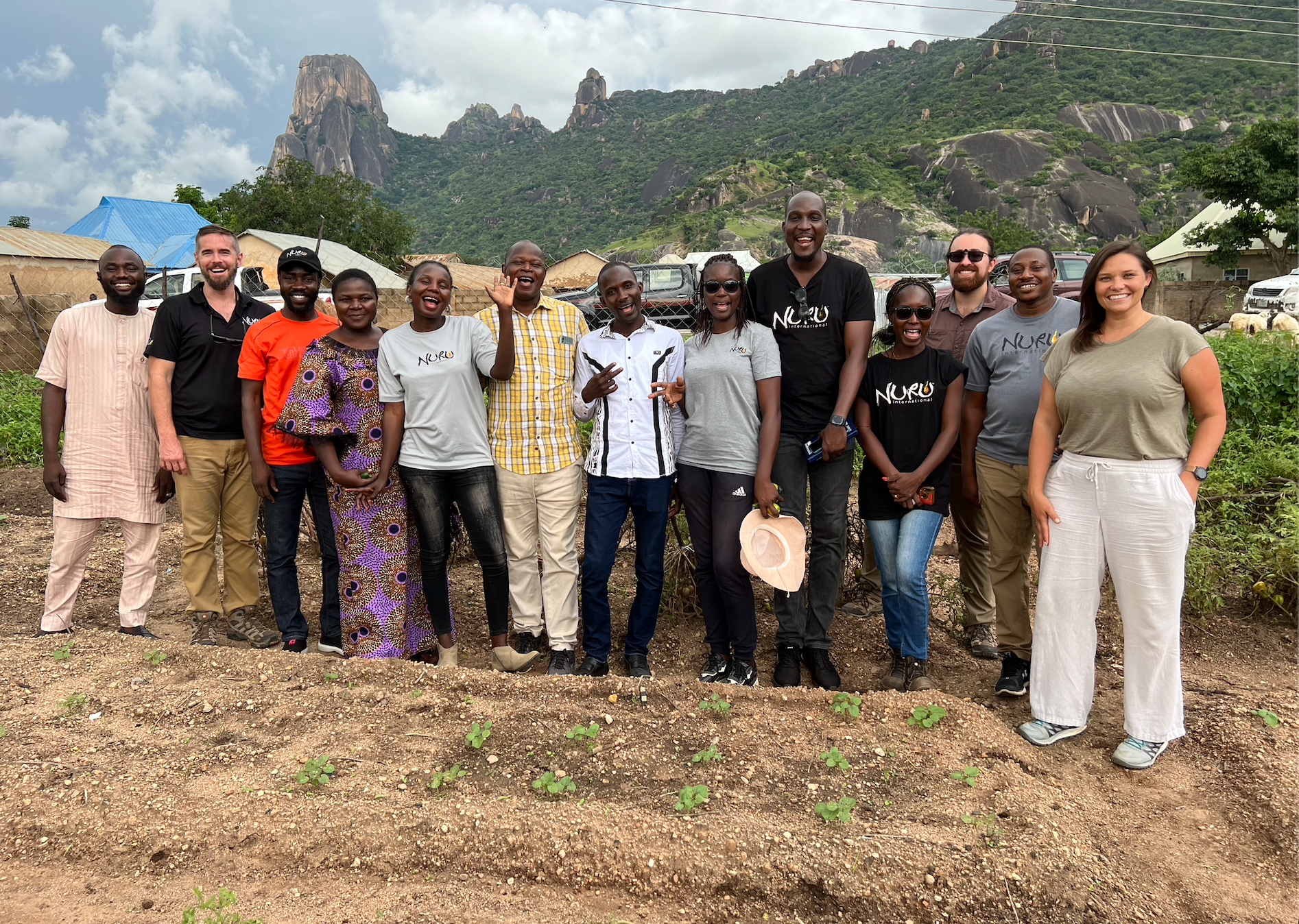 large group if people from Nigeria, Burkina Faso, and the US standing together outside smiling 