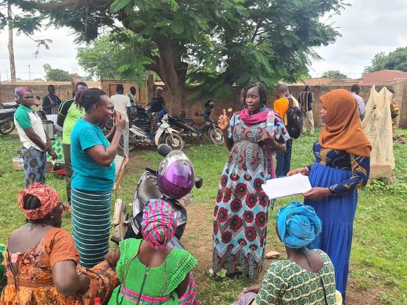 group of women standing outside in Burkina Faso and having a conversation