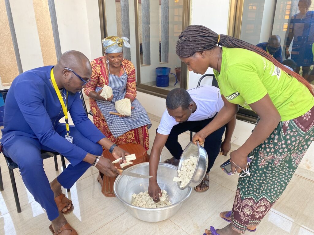 group of people making tofu together