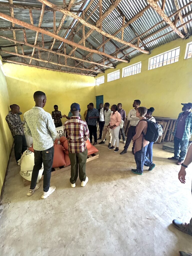 group of people standing together in a warehouse facility